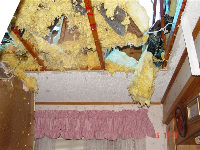Insulation exposed from the ceiling following the storm.